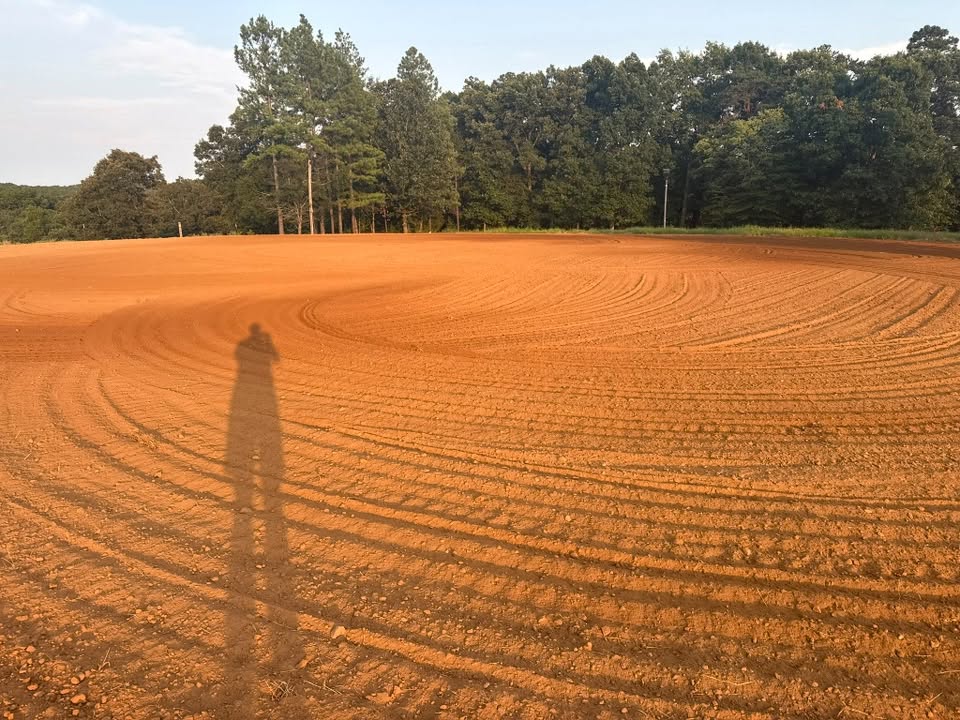 The freshly groomed outdoor riding arena at Threefold Stables